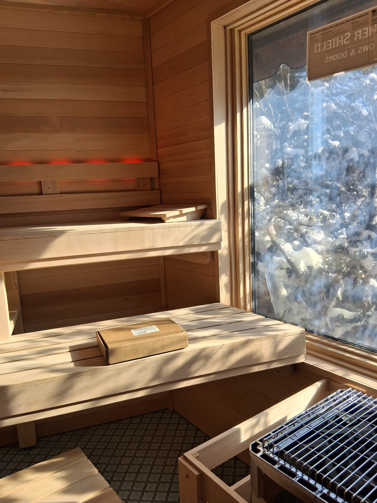 Sauna bench and window detail from inside the room.
